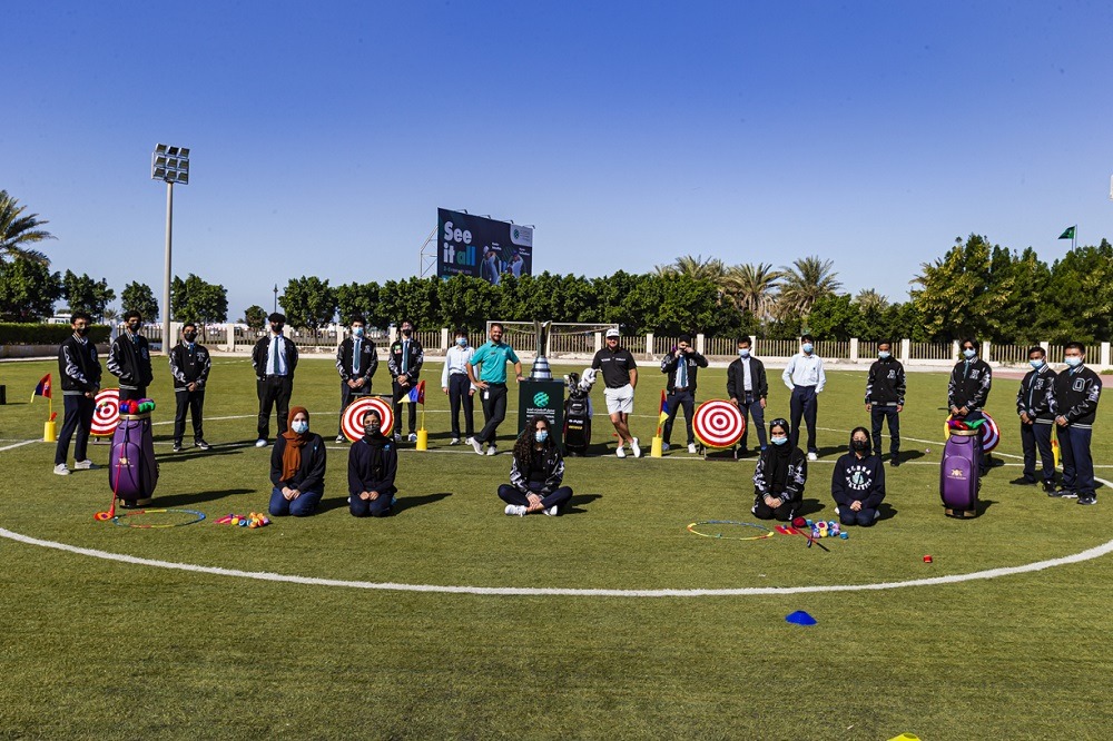 Superstar golfers Graeme McDowell and Patrick Reed wrap-up the Saudi International Trophy Tour with 300-pupil golf lesson in KAEC school