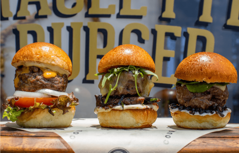 Couqley Celebrates International Burger Day with the Trio Magnifique: The Best Couqley Burgers on One Plate